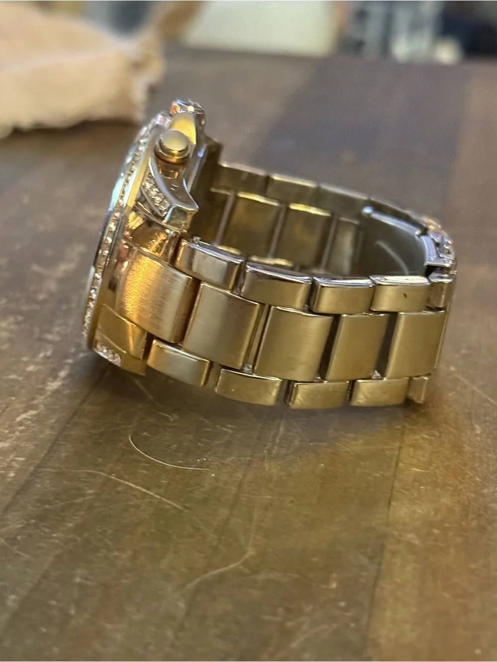 Unlisted by Kenneth Cole gold stainless steel crystal bezel watch